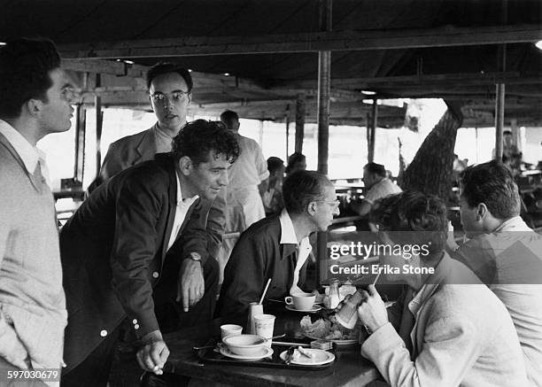 American composer and conductor Leonard Bernstein at lunch with fellow composers Aaron Copland and Lukas Foss , and pianist and teacher Seymour...