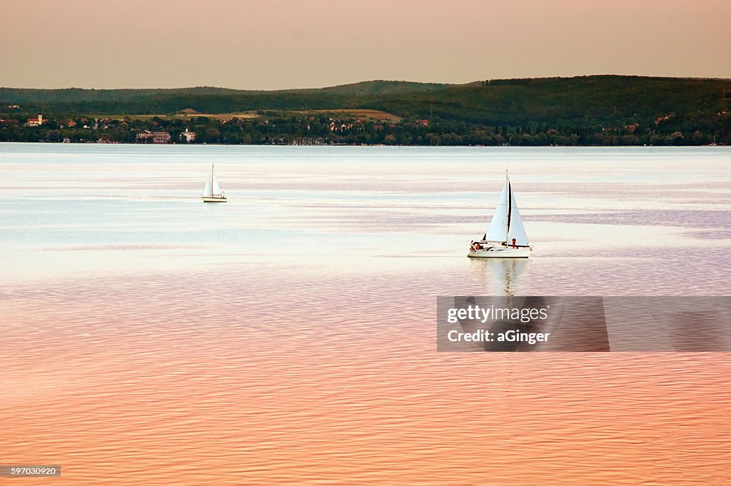 Balaton lake with boats in sunset