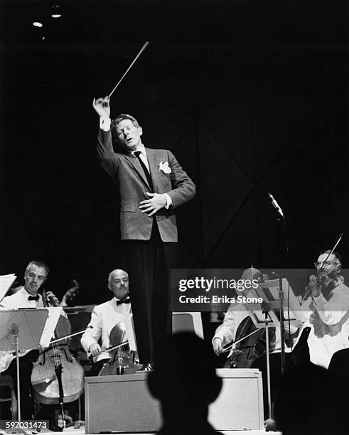 American actor, singer and comedian Danny Kaye conducts a concert by the Boston Symphony Orchestra at Tanglewood in Massachusetts, 1961.