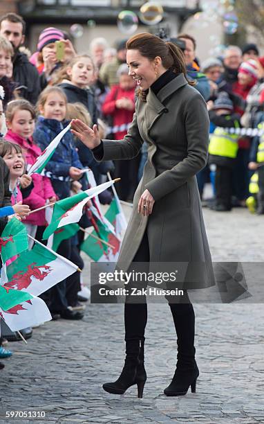 Catherine, Duchess of Cambridge, wearing a green Reiss coat, visits Caernarfon in North Wales.