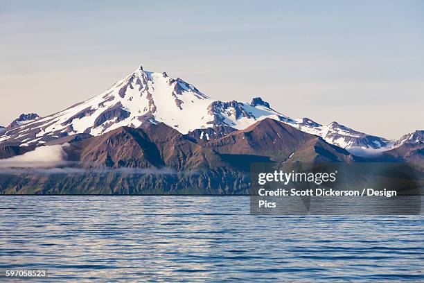 frosty peak volcano on the alaska peninsula in summertime - alaska peninsula stock pictures, royalty-free photos & images