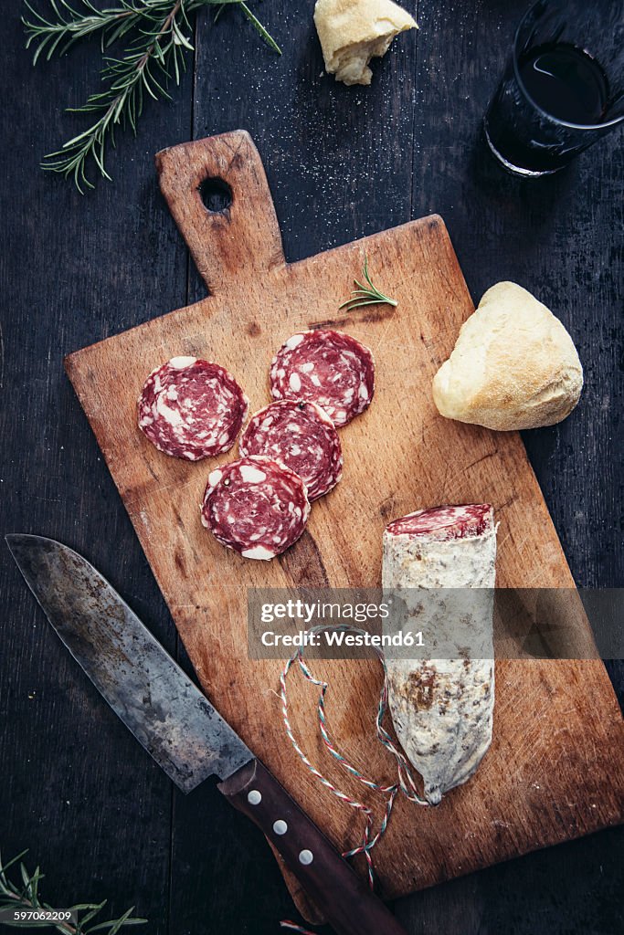 Sliced salami on cutting board