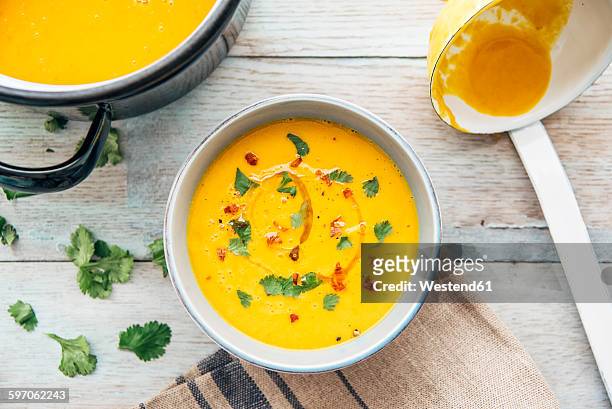 squash soup with cilantro and chili - soup stock pictures, royalty-free photos & images