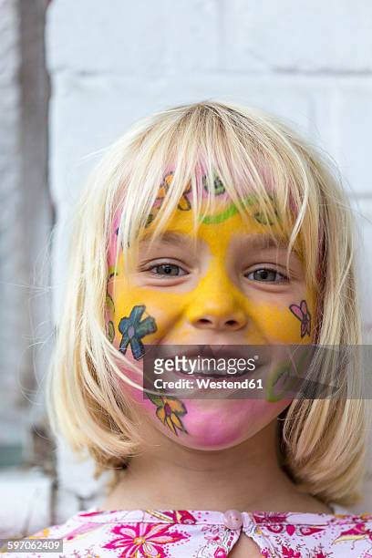 portrait of smiling blond girl with painted face - tinta facial imagens e fotografias de stock
