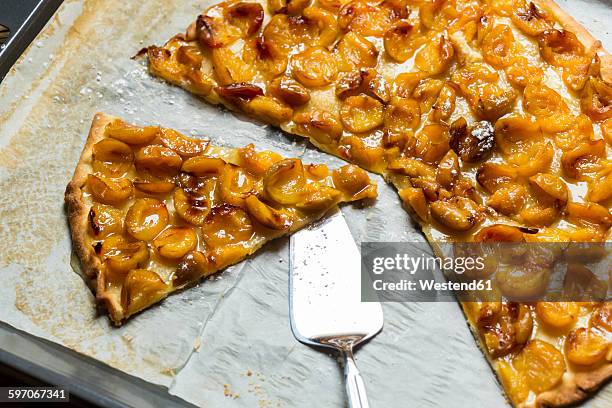 home-baked mirabelle tart on baking tray - mirabelle stock-fotos und bilder