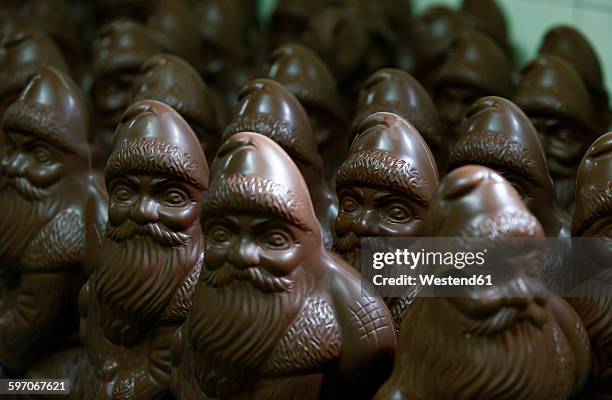 many chocolate santa clauses - schokonikolaus stock-fotos und bilder