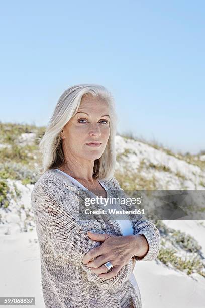 best ager woman at the beach - best ager woman stockfoto's en -beelden