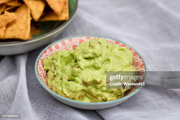 bowl of guacamole - guacamole stock pictures, royalty-free photos & images