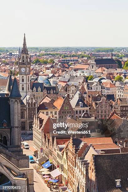 belgium, ghent, old town, cityscape with guild houses and belfry of the old post office - gent belgien stock-fotos und bilder