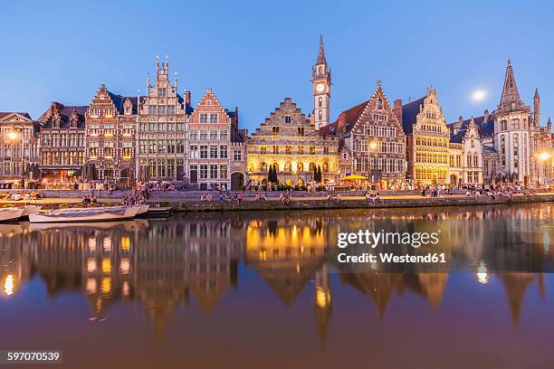 belgium, ghent, old town, graslei, historical houses at river leie at dusk - gent belgien stock-fotos und bilder