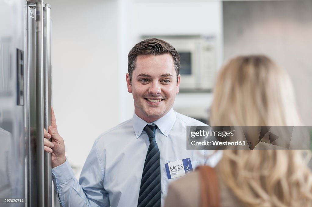 Shop assistant smiling at customer