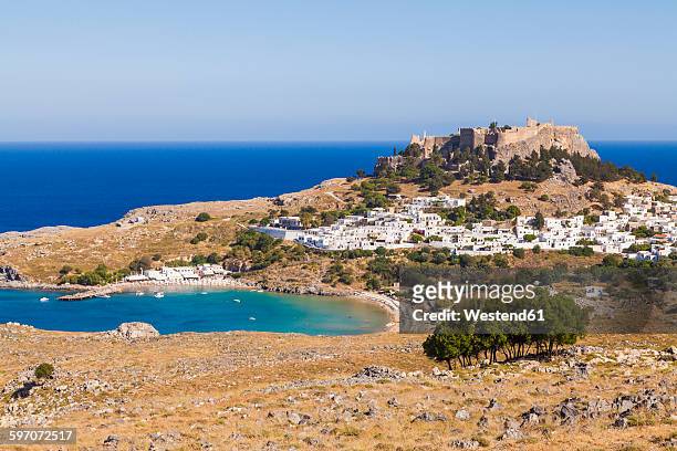 greece, aegean islands, rhodes, lindos, view to acropolis of lindos - rhodes,_new_south_wales stock pictures, royalty-free photos & images
