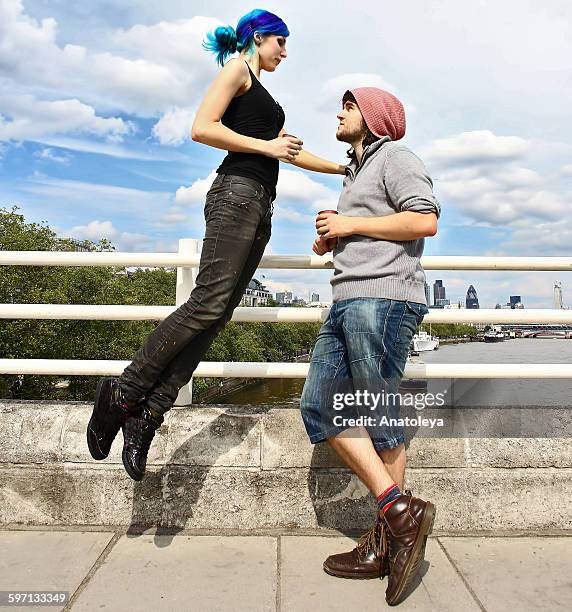 girl floating on bridge with boyfriend - anatoleya stock pictures, royalty-free photos & images