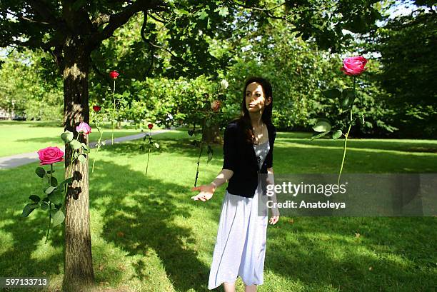 girl with floating roses - anatoleya stock pictures, royalty-free photos & images