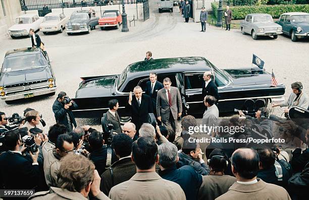 Members of the United States diplomatic delegation, led by W Averell Harriman and Cyrus Vance emerge from their limousine as they arrive for initial...