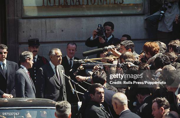 Members of the United States diplomatic delegation, led by W Averell Harriman and Cyrus Vance meet members of the press as they arrive for initial...