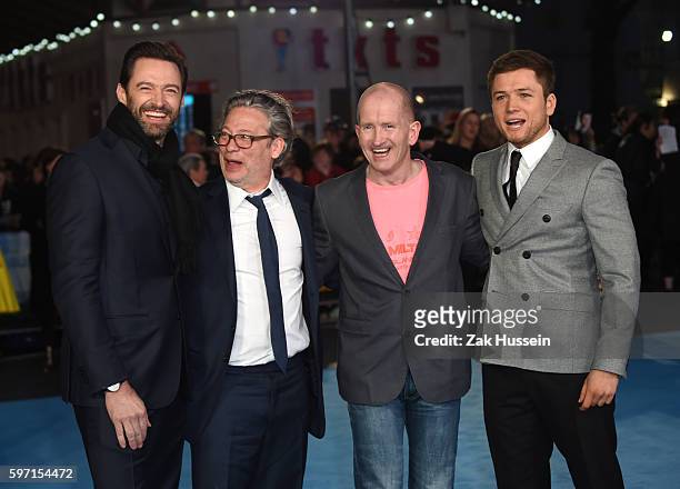 Hugh Jackman, Dexter Fletcher, Eddie Edwards and Taron Egerton arriving at the European premiere of Eddie the Eagle at the Odeon Leicester Square in...