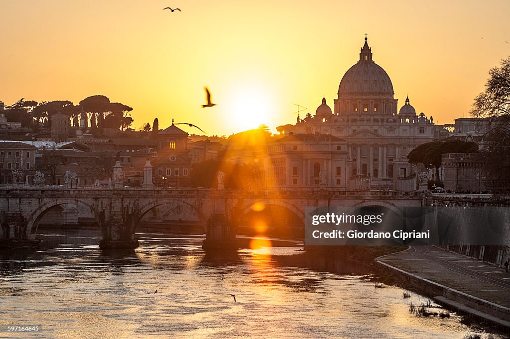 Sunset view of Basilica St. Peter and river Tiber