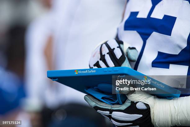 Members of the New York Giants go over game plans on a Microsoft Surface tablet during the game against the Buffalo Bills on August 20, 2016 at New...