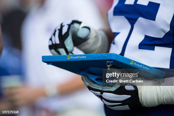 Members of the New York Giants go over game plans on a Microsoft Surface tablet during the game against the Buffalo Bills on August 20, 2016 at New...