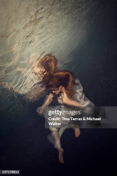 woman underwater - white dress stock pictures, royalty-free photos & images