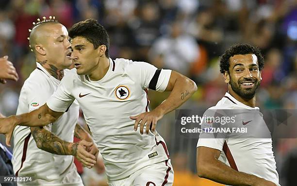 Roma's forward Diego Perrotti celebrates after scoring a goal during the Serie A football match between Cagliari and Roma at the Sant'Elia stadium in...