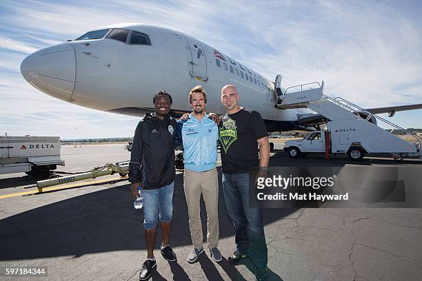 Seattle Sounders alumni Steve Zakuani, Roger Levesque and Marcus Hahnemann arrive after the Delta Fabric of Sounders FC Fan Flight to Portland on...