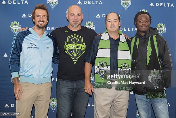 Roger Levesque, Marcus Hahnemann, Mike Medeiros and Steve Zakuani attend the Delta Fabric of Sounders FC Fan Flight to Portland on August 28, 2016 in...