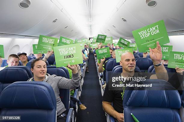 Marcus Hahnemann and fans hold signs during of Delta Fabric of Sounders FC Fan Flight to Portland on August 28, 2016 in Seattle, Washington.