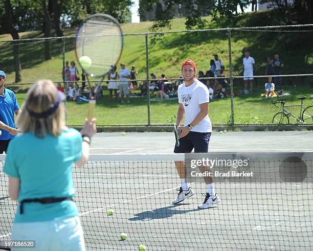 Tennis Player Denis Kudla LACOSTE And City Parks Foundation Host Tennis Clinic In Central Park at Central Park Tennis Center on August 28, 2016 in...