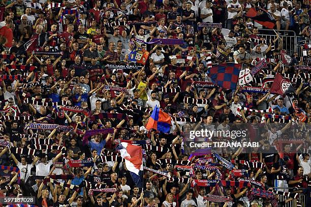 Cagliari's supporters cheer for their team during the Serie A football match between Cagliari and Roma at the Sant'Elia stadium in Cagliari on August...