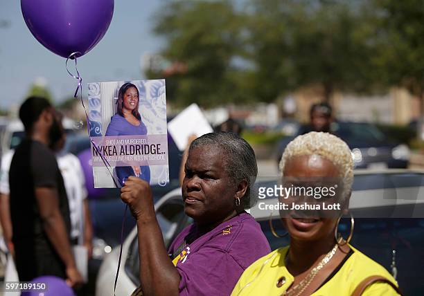 People attend a prayer vigil for Nykea Aldridge outside Willie Mae Morris Empowerment Center on August 28, 2016 in Chicago, Illinois. Nykea Aldridge,...