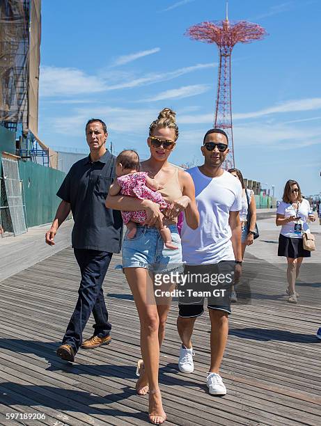 Chrissy Teigen and John Legend are seen walking to "Sports Illustrated" event at Coney Island on August 28, 2016 in New York City.