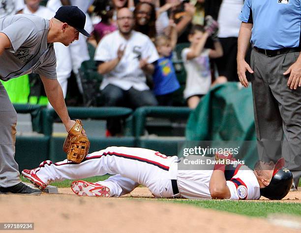 Melky Cabrera of the Chicago White Sox is safe at third base with an RBI triple as Kyle Seager of the Seattle Mariners makes a late tag during the...