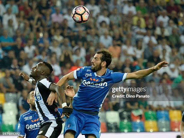Emmanuel Agyemang Badu of Udinese Calcio competes with Riccardo Saponara of Empoli FC during the Serie A match between Udinese Calcio and Empoli FC...
