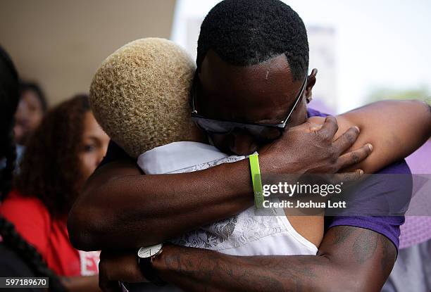 Diann Aldridge , the mother of Nykea Aldridge is embraced with a hug during a prayer vigil for her daughter outside Willie Mae Morris Empowerment...