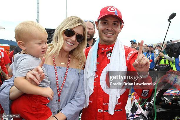 Kyle Larson, driver of the Target Chevrolet, girlfriend Katelyn Sweet and son Owen Larson celebrate in Victory Lane after winning the NASCAR Sprint...