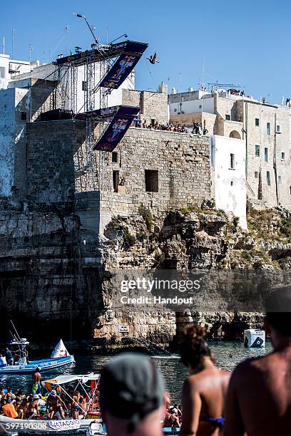 In this handout image provided by Red Bull, Kris Kolanus of Poland dives from the 27 metre platform during the fifth stop of the Red Bull Cliff...