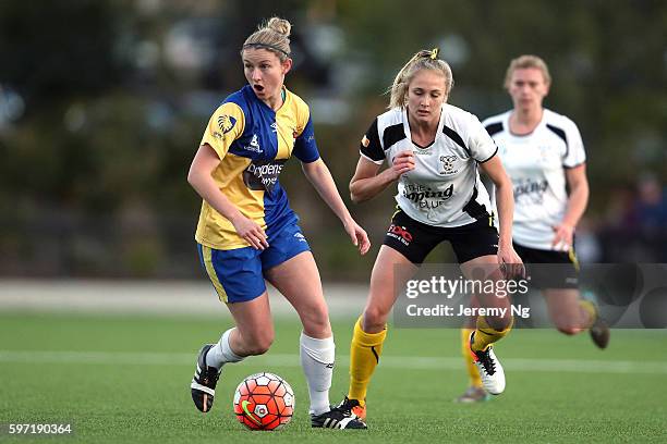 Tara Andrews of the Koalas and Elizabeth O'Reilly of Sydney University SFC challenge for the ball during the 2016 NPL Womens 1 Grand Final match...