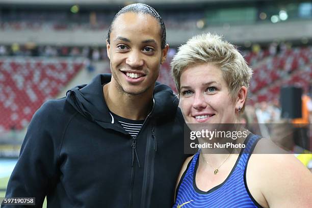 Poland's Olympic champion Anita Wlodarczyk pose with Pascal Martinot-Lagarde after breaking her own world record in the Women's Hammer Throw during...