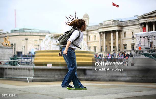 hoverboarding through trafalgar square - anatoleya stock pictures, royalty-free photos & images