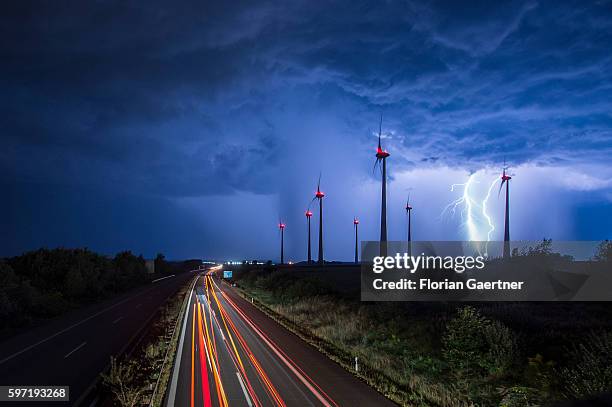 Lightning strikes behind wind turbines during a thunderstorm near the border between Germany and Poland on August 28, 2016 in Goerlitz, Germany....