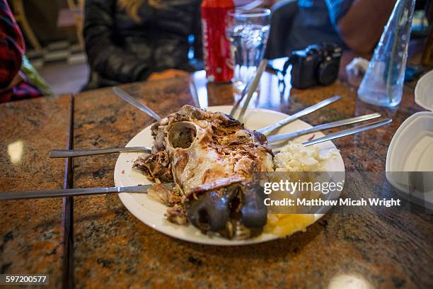 people try the local delicacy of sheep's head. - reykjavik women stock pictures, royalty-free photos & images