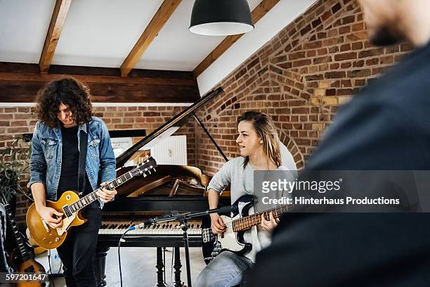 rehearsal in a small recording studio - guitarist band stock pictures, royalty-free photos & images