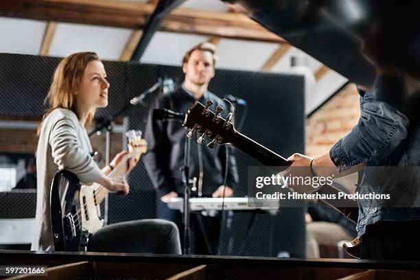 young band recording music in a studio - band rehearsal stock pictures, royalty-free photos & images