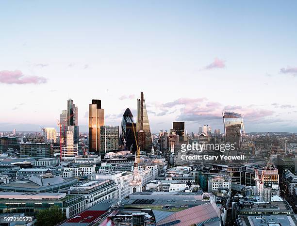 elevated view over london city skyline at sunset - london stockfoto's en -beelden