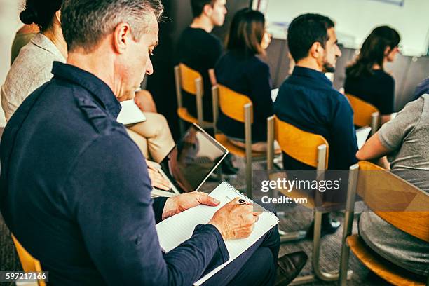 close up of audience - vakbond stockfoto's en -beelden