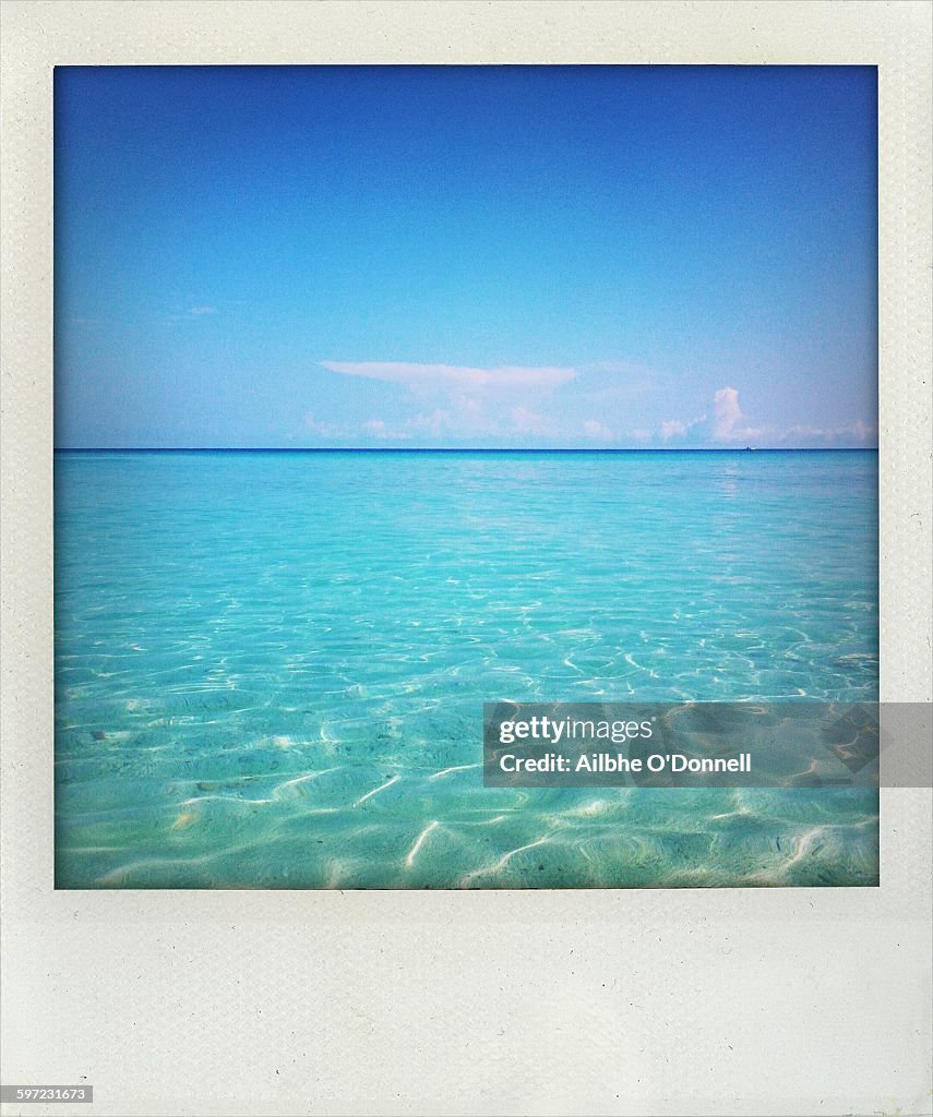 Peaceful water and blue sky in Cuba polaroid