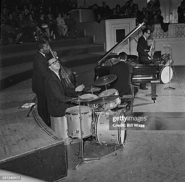 The Dave Brubeck Quartet in concert in Birmingham Town Hall, Birmingham, UK, circa 1960. They are drummer Joe Morello, double bassist Eugene Wright,...