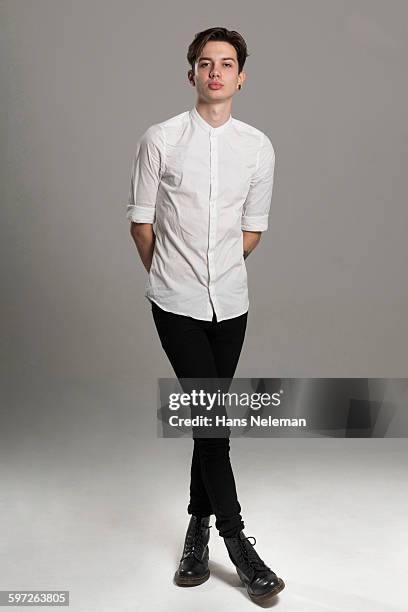 portrait of a young man indoors - man white studio shot collared shirt stock pictures, royalty-free photos & images